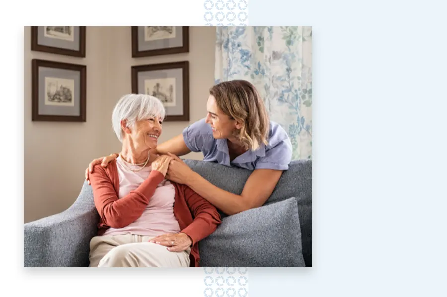 nurse and resident smiling at each other